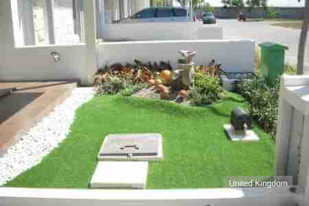 Artificial grass landscape in front of the door