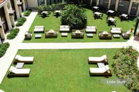 Artificial grass lounge area at a resort hotel