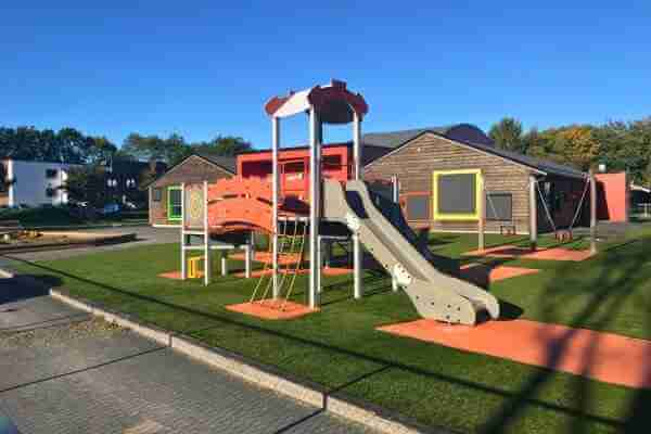 Sunny kindergarten outdoor artificial grass playground
